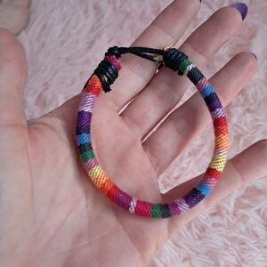 Dolls Kill Rainbow Woven Cord Bracelet with Black Closure